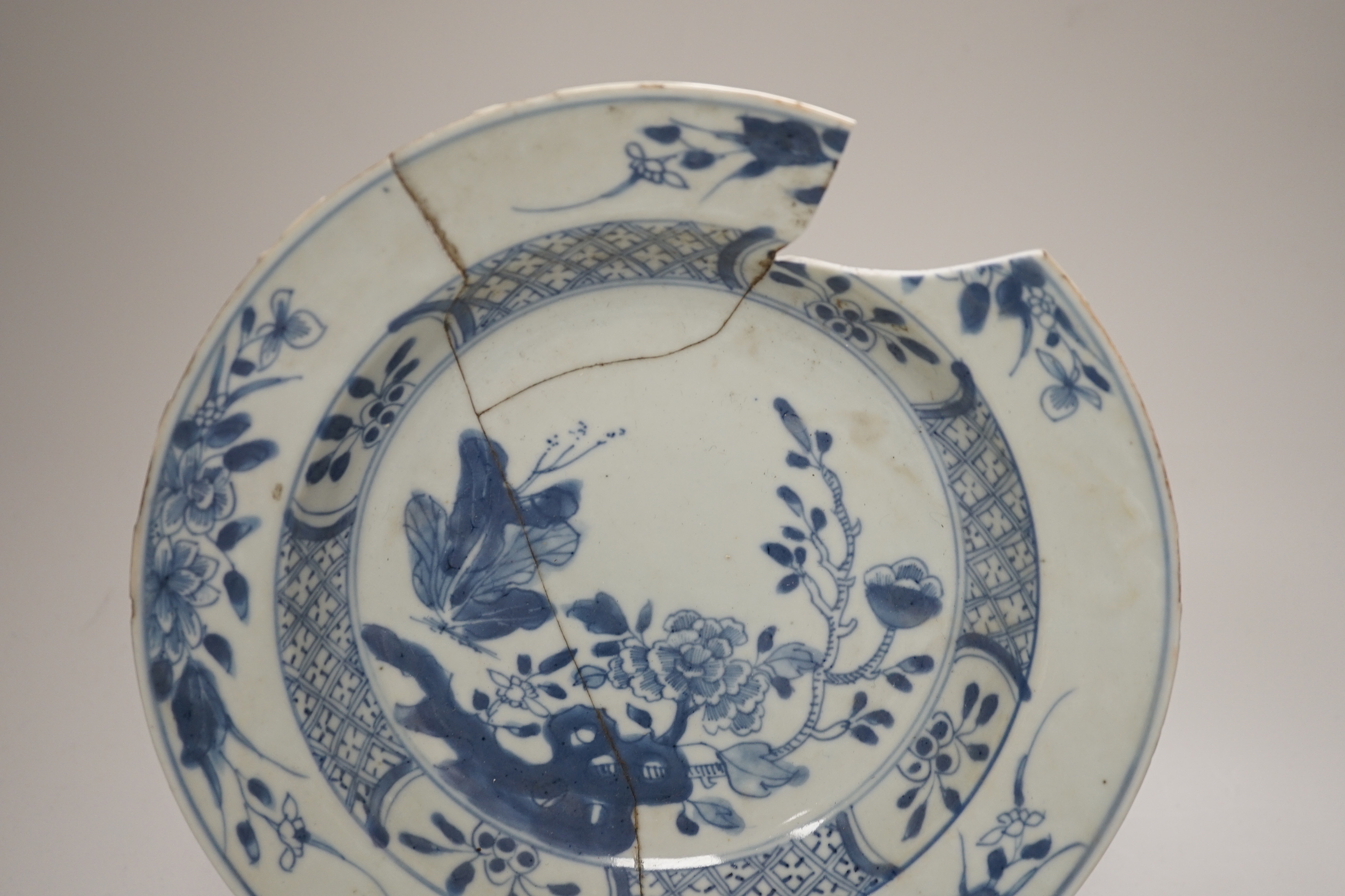 An 18th century Chinese export blue and white dish, celadon glazed tripod censer (20th century) and a Japanese Arita teacup